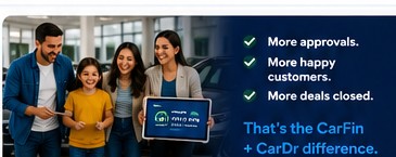 Dealer and happy family after used car loan approval